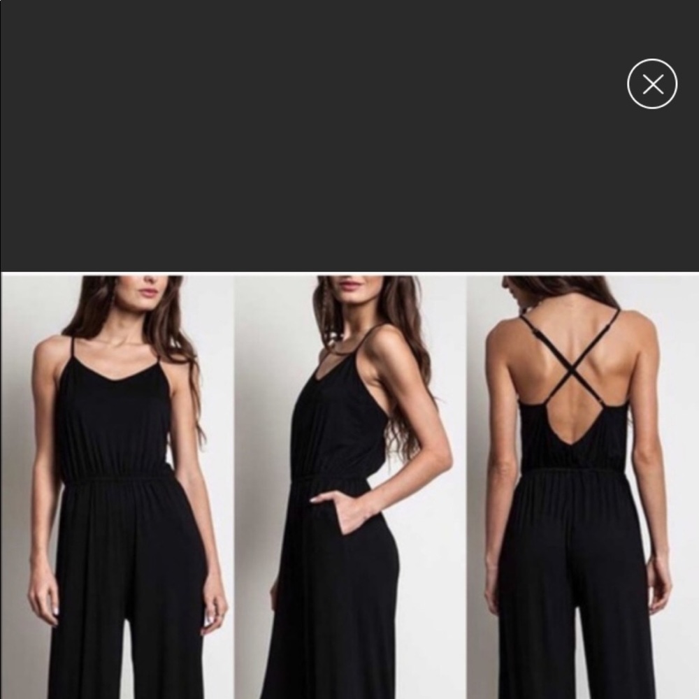 Cross cross Black Jumpsuit. NWT